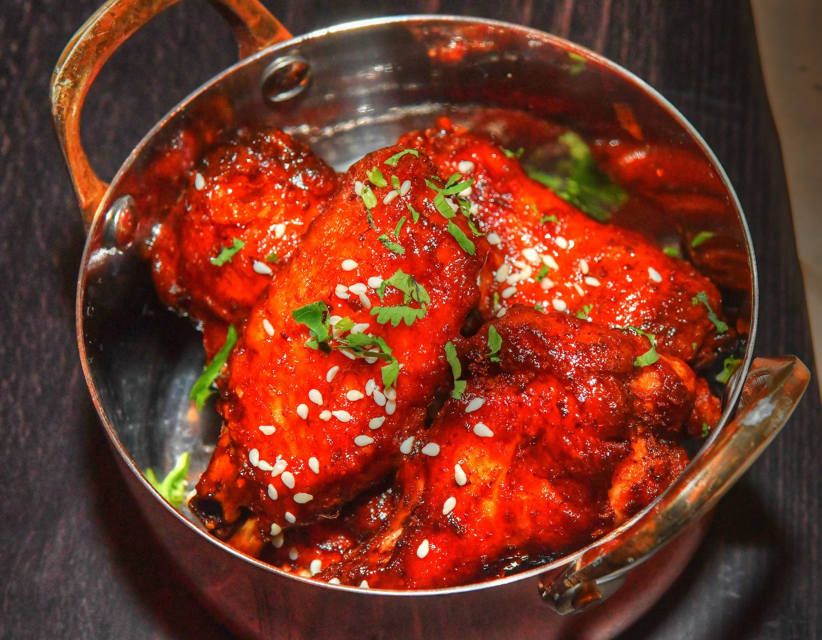 Mango Chile Wings from Tandoori Pizza & Wing Co. at the new Politan Row at Colony Square. (Chris Hunt for The Atlanta Journal-Constitution)