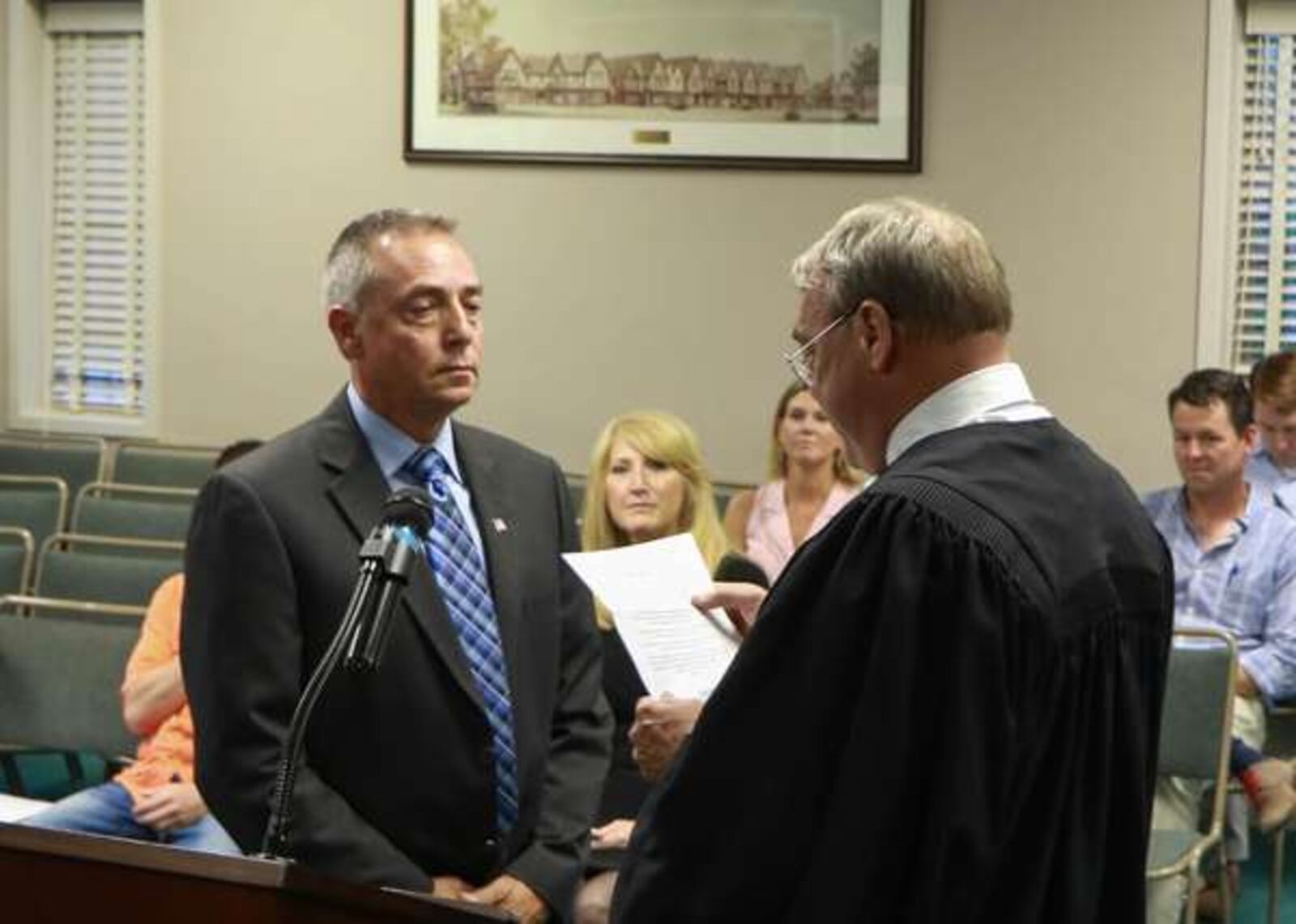 With family and friends looking on Lynn Thomas is sworn in as new Avondale Estates police chief. (Courtesy of Nick Rasay)