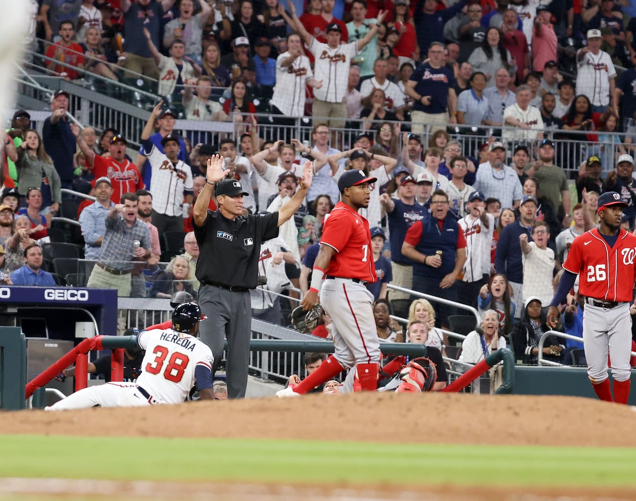 Braves right fielder Guillermo Heredia (38) was safe after being caught in a rundown in a baseball game at Truist Park on Tuesday, April 12, 2022. Miguel Martinez/miguel.martinezjimenez@ajc.com