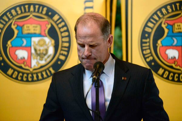 University of Missouri system President Tim Wolfe announces his resignation from office, Monday, Nov. 9, 2015, during a UM System Board of Curators meeting in University Hall at the campus in Columbia, Mo. Wolfe has been under fire for his handling of race complaints that had threatened to upend the football season and moved one student to go on a hunger strike. (Justin L. Stewart/Columbia Missourian via AP)