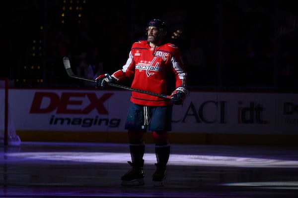 Washington Capitals left wing Alex Ovechkin (8) stands on the ice before an NHL hockey game against the Pittsburgh Penguins, Friday, Nov. 8, 2024, in Washington. (AP Photo/Nick Wass)