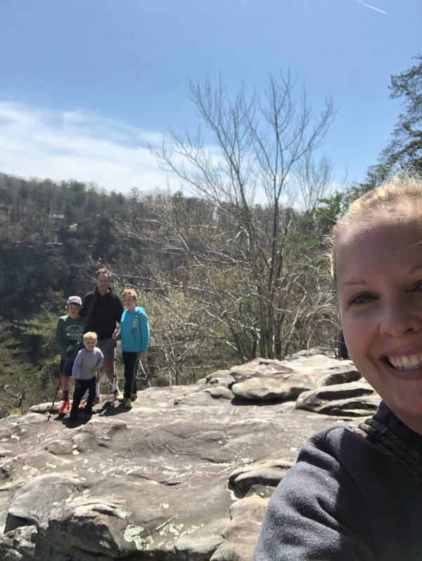 Cheri Thome and her family pose at a mountaintop during her family vacation. 
Courtesy of Cheri Thome