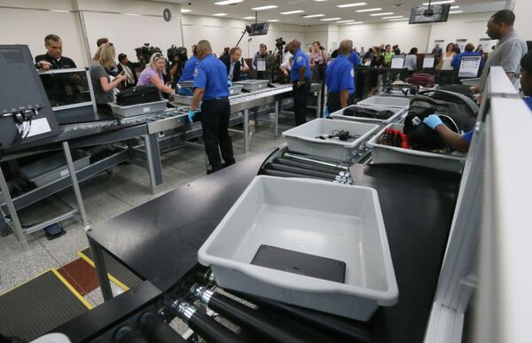 May 25, 2016 - Atlanta - Powered rollers transport bags automatically through the screening process. TSA unveiled new security "smart lanes" that have been installed in the South Security Checkpoint, which feature automated equipment that handles baggage. BOB ANDRES / BANDRES@AJC.COM