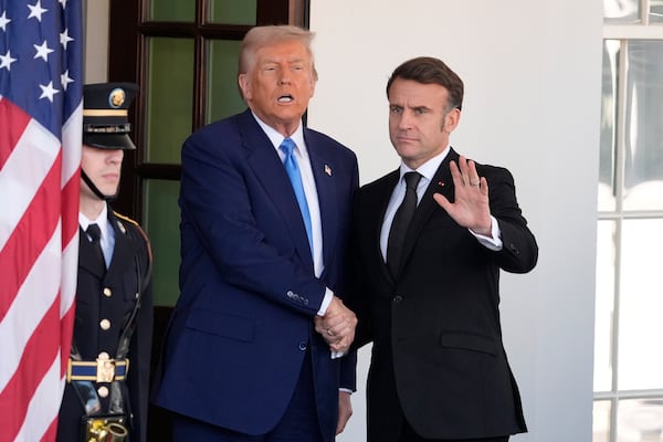 President Donald Trump speaks as he greets France's President Emmanuel Macron, right, before a news conference at the White House, Monday, Feb. 24, 2025, in Washington. (AP Photo/Manuel Balce Ceneta)