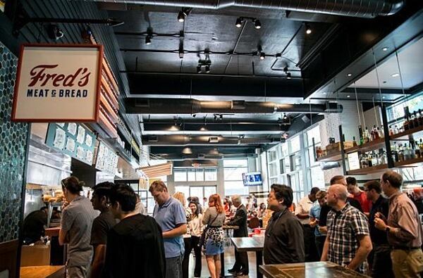 Customers line up at Fred's Meat and Bread at The Canteen micro food hall in Midtown.