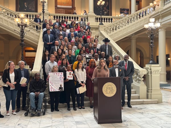 Michal Roseberry, a victim of human trafficking, speaks against Gov. Brian Kemp's proposal to limit lawsuits on Thursday at the Georgia Capitol in Atlanta. Charlotte Kramon/AP