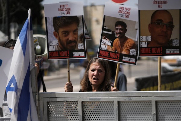 Israels calling for the release of hostages held in the Gaza Strip and saying the resumption of fighting in Gaza puts their loved ones at risk, outside the Knesset, Israel's parliament, in Jerusalem, Tuesday, March 18, 2025. (AP Photo/Mahmoud Illean)