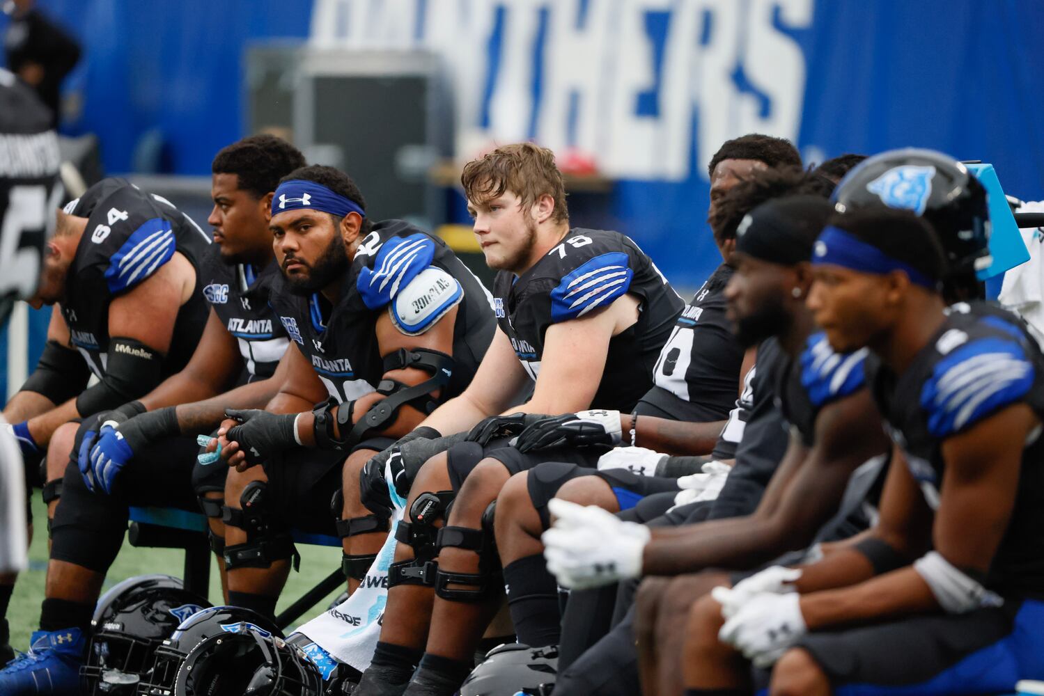 Georgia State Panthers offensive tackle Bryson Broadway (75) sits with teammates after they fell behind late in the fourth quarter.  (Bob Andres for the Atlanta Journal Constitution)