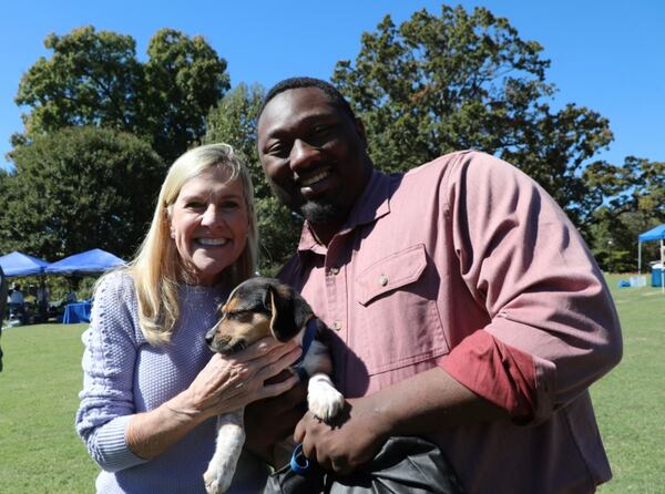 First lady Marty Kemp hosted her annual Pet Adoption Day at the Georgia Governor’s Mansion Saturday. Kemp congratulates Garrison Douglas, a spokesman for Gov. Brian Kemp, who adopted Cobb County rescue puppy Dixie. (Courtesy photo)