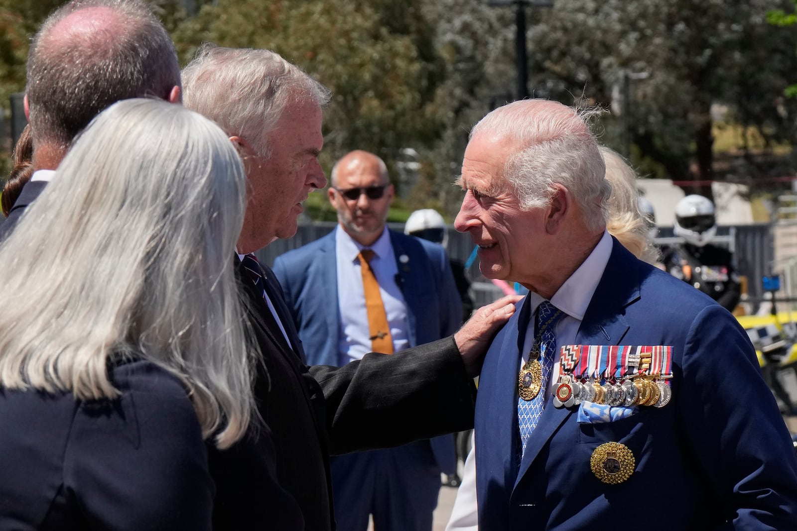 Kim Beazley, third left, chair of Australian War Memorial Council, meets Britain's King Charles III, right, on the king's arrival with Queen Camilla in Canberra, Australia, Monday, Oct. 21, 2024.