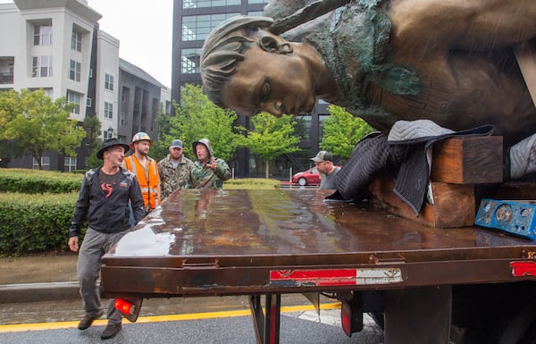 Artist Stan Mullins (L) Looks over his statue of Tomochichi, chief of the Yamacraw,  before its temporary installation at the Millennium Gate Museum on 17th St. Monday, September 20, 2021. STEVE SCHAEFER FOR THE ATLANTA JOURNAL-CONSTITUTION