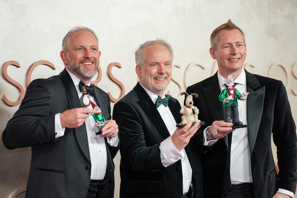 Richard Beek, from left, Nick Park and Merlin Crossingham arrive at the Oscars on Sunday, March 2, 2025, at the Dolby Theatre in Los Angeles. (AP Photo/Jae C. Hong)