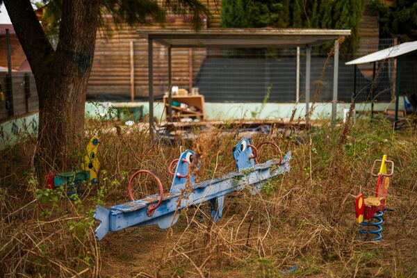 The weeds grow in a deserted kindergarten playground in Shlomi, northern Israel, near to the border with Lebanon, Wednesday, Nov. 27, 2024. (AP Photo/Francisco Seco)