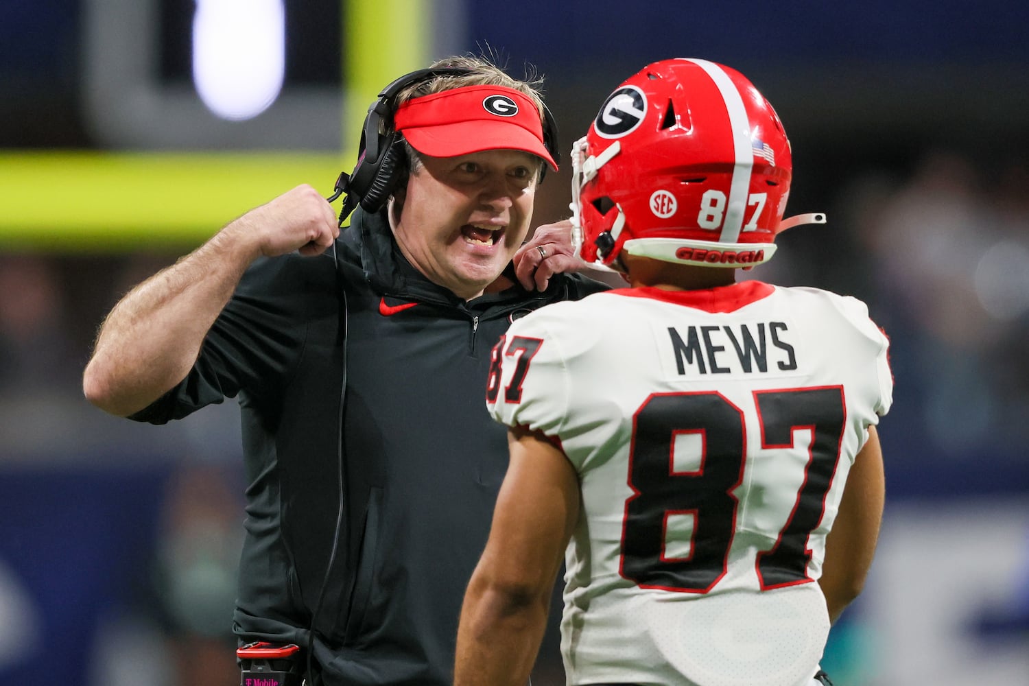 Georgia Bulldogs head coach Kirby Smart talks to Georgia Bulldogs wide receiver Mekhi Mews (87) during the fourth quarter of the SEC Championship football game against the Alabama Crimson Tide at the Mercedes-Benz Stadium in Atlanta, on Saturday, December 2, 2023. (Jason Getz / Jason.Getz@ajc.com)