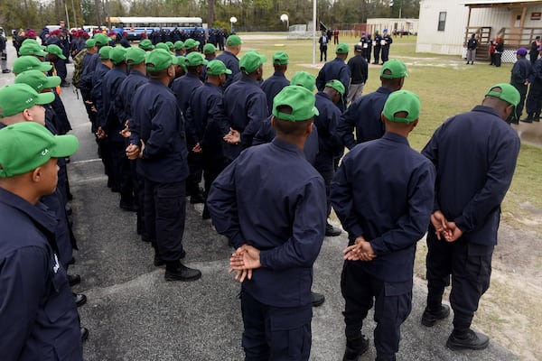 Cadets at the Fort Stewart Youth Challenge Academy stand in formation during a campus tour in February 2020. An AJC investigation in 2020 found the state-run boot camp’s adult platoon instructors — known as cadre — physically abused teenage cadets and sexually harassed female staff. The YCA program offers a quasi-military experience for teens, age 16 to 18, dividing them into platoons. The program's Fort Gordon camp made news in October 2022 when a massive brawl between different platoons caused leaders to shut down the class  and send the cadets home.  RYON HORNE / RHORNE@AJC.COM