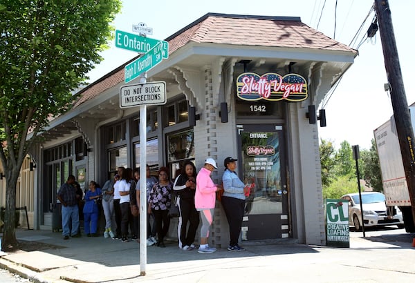 Customers line up outside the Slutty Vegan, which serves naughty-named meatless burgers like the One Night Stand and Menage a Trois. CONTRIBUTED