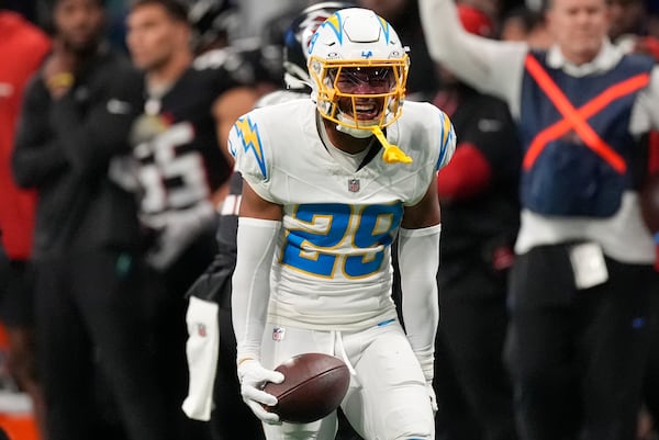 Los Angeles Chargers cornerback Tarheeb Still (29) celebrates an interception during the first half of an NFL football game against the Atlanta Falcons on Sunday, Dec. 1, 2024 in Atlanta.(AP Photo/John Bazemore)