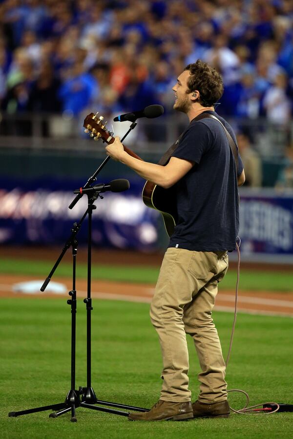 KANSAS CITY, MO - OCTOBER 22: Phillip Phillips performs the national anthem prior to Game Two of the 2014 World Series between the Kansas City Royals and the San Francisco Giants at Kauffman Stadium on October 22, 2014 in Kansas City, Missouri. (Photo by Jamie Squire/Getty Images) KANSAS CITY, MO - OCTOBER 22: Phillip Phillips performs the national anthem prior to Game Two of the 2014 World Series between the Kansas City Royals and the San Francisco Giants at Kauffman Stadium on October 22, 2014 in Kansas City, Missouri. (Photo by Jamie Squire/Getty Images)