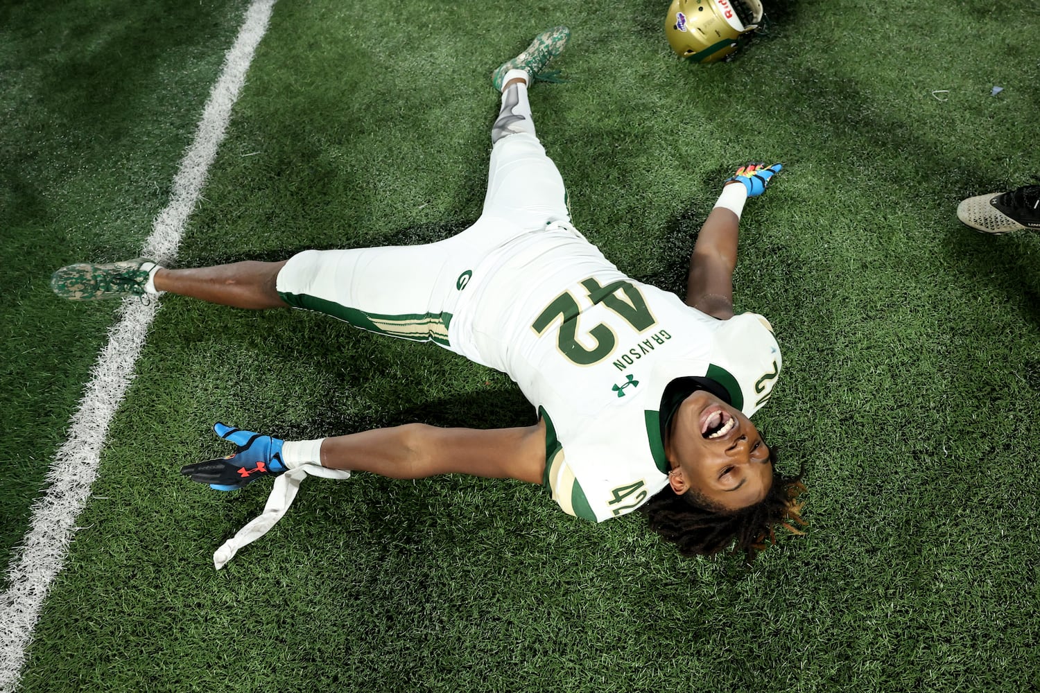 Dec. 30, 2020 - Atlanta, Ga: Grayson linebacker Franklin Neal celebrates on the field after their 38-14 win against Collins Hill during the Class 7A state high school football final at Center Parc Stadium Wednesday, December 30, 2020 in Atlanta. JASON GETZ FOR THE ATLANTA JOURNAL-CONSTITUTION