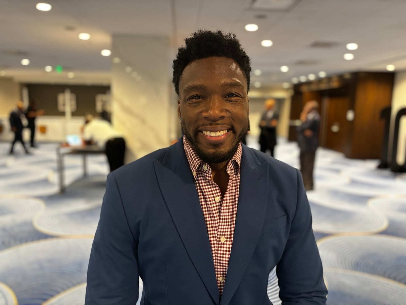 Ken Wainwright attends the 100 Black Men of America conference in Atlanta on June 14, 2024. After seeing Donald Trump’s speech Tuesday, he said he’s leaning toward supporting the former president and he predicted he won’t be alone. (Greg Bluestein/AJC) 