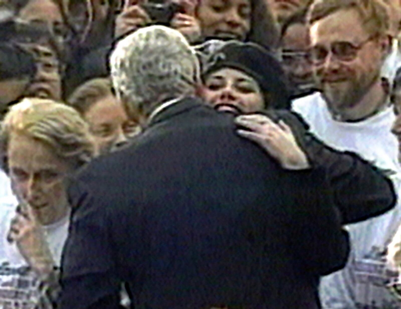 White House intern Monica Lewinsky embraces then President Clinton as he greeted well-wishers at a White House lawn party in Washington Nov. 6, 1996. Clinton submitted a DNA  test during an independent counsel investigation into whether he had a sexual relationship with  Lewinsky and then lied about it under oath.