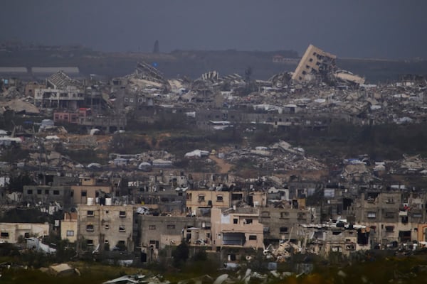 Buildings destroyed during the Israeli air and ground offensive in the Gaza Strip as seen from southern Israel, Thursday, March 20, 2025. (AP Photo/Leo Correa)