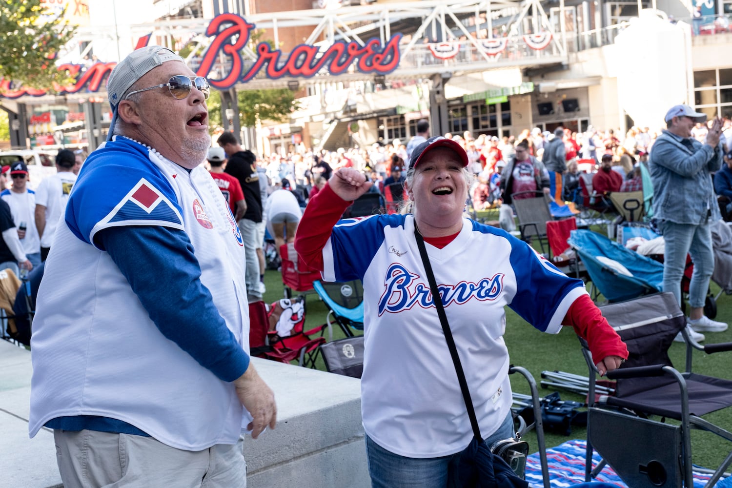 Braves fans Sean and Stacy Garguilo dance to Party Nation at the Battery before game one of the National League Division Series in Atlanta on Saturday, Oct. 7, 2023.   (Ben Gray / Ben@BenGray.com)