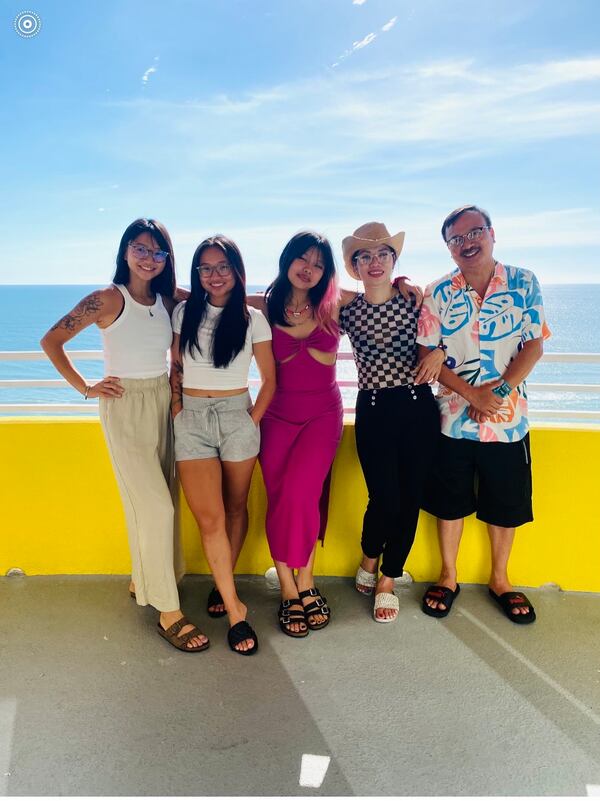 The Dang family was close, choosing to spend their time together walking their dogs, exercising or cooking. Shown in a family photo (from left) are sisters Mary, Mitchel and Maggie, followed by their mother Truc Ngo and father Minh Dang.