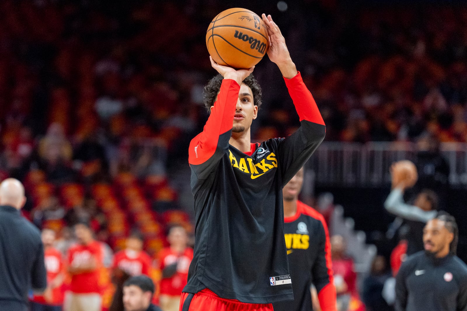 Atlanta Hawks forward Zaccharie Risacher (10) warms up during the first half of an NBA basketball game against the Brooklyn Nets, Wednesday, Oct. 23, 2024, in Atlanta. (AP Photo/Jason Allen)