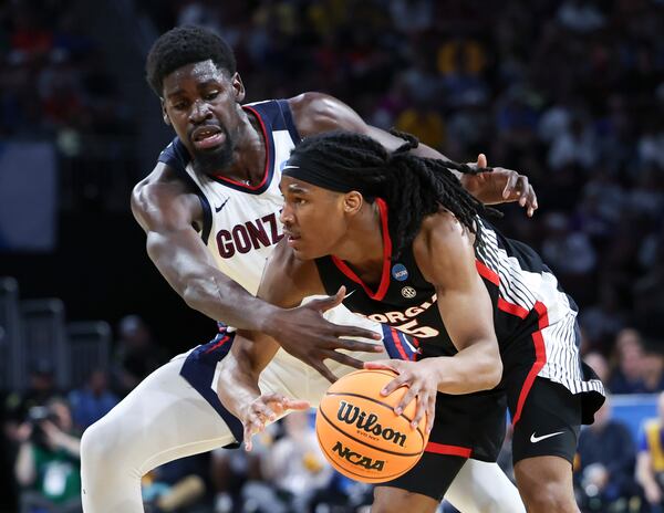 Georgia guard Silas Demary Jr. (5) tries to get past Gonzaga forward Graham Ike, left, during the second half in the first round of the NCAA college basketball tournament, Thursday, March 20, 2025, in Wichita, Kan. (AP Photo/Travis Heying)