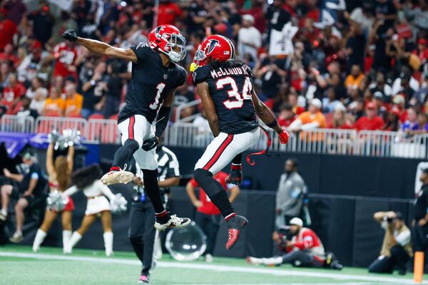 Atlanta Falcons wide receiver Ray-Ray McCloud III (34) celebrates with wide receiver Darnell Mooney (1) after his touchdown during the first half of an NFL football game against the Tampa Bay Buccaneers on Thursday, October 3, 2024, at Mercedes-Benz Stadium in Atlanta. 
(Miguel Martinez/ AJC)