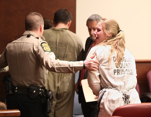 FKayla Norton yells “I love you guys!” to the crowd that gathered to support her at her sentencing at the Douglas County Monday. (Henry Taylor / henry.taylor@ajc.com)