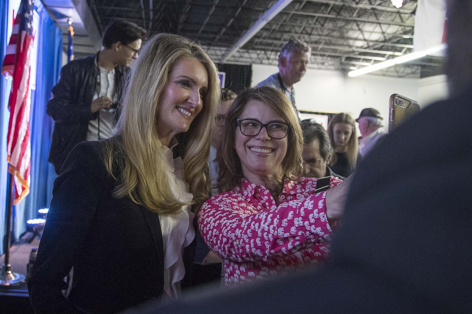 Georgia U.S. Sen. Kelly Loeffler takes a photo with a supporter during her rally earlier this month at the Cobb County Republican Party’s headquarters in Marietta. Loeffler is now facing some scrutiny over stock transactions made following her attendance at a senators-only briefing on the coronavirus. She has called the accusations politically motivated and said her stock “portfolio is managed by third parties” and she had no knowledge of them until days or weeks after they occurred. (ALYSSA POINTER/ALYSSA.POINTER@AJC.COM)