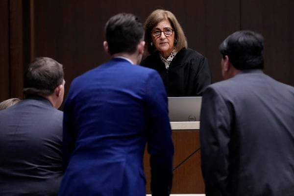 FILE - Judge Victoria A. Rossetti, second from right, talks to Robert E. Crimo III's attorney Gregory Ticsay, right, Lake County's assistant public defender Anton Trizna, second from left, and Lake County, Ill., State's Attorney Eric Rinehart during the jury selection for the trial of Robert E. Crimo III., at the Lake County Courthouse, Waukegan, Ill., Monday, Feb. 24, 2025. (AP Photo/Nam Y. Huh, Pool, File)