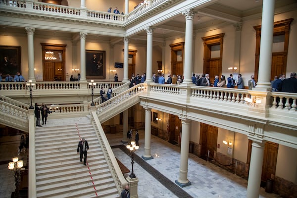 01/27/2021 — Atlanta, Georgia —Georgia lawmakers, lobbyist and staff gather in the hallways on the sixth day of the 2021 legislative session at the Georgia State Capitol building in Atlanta, Wednesday, January 27, 2021. (Alyssa Pointer / Alyssa.Pointer@ajc.com)