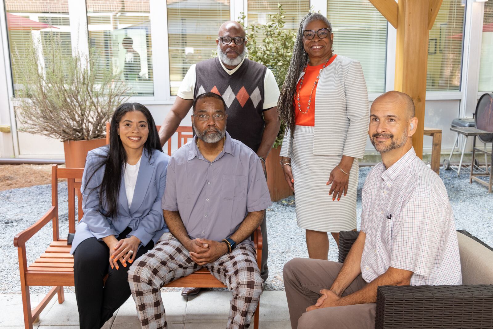 Ivy Porter-Henderson (from left), Bradley Porter, Dominic Johnson, Carol Collard and Kevin Henderson in the Hope House courtyard in Atlanta. 
PHIL SKINNER FOR THE ATLANTA JOURNAL-CONSTITUTION.