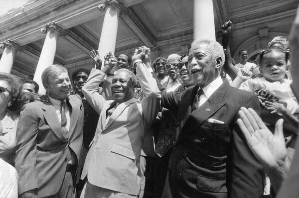 FILE -- Archie Spigner, center, in 1993 with New York City Council majority leader Peter F. Vallone and Mayor David Dinkins at right. Spigner, a New York City councilman who was a political kingmaker in southeast Queens for a half-century, helping fellow Black politicians climb the ladder and coaxing jobs and construction projects into his district, died on Oct. 29, 2020, in Queens. He was 92. (John Sotomayor/The New York Times)