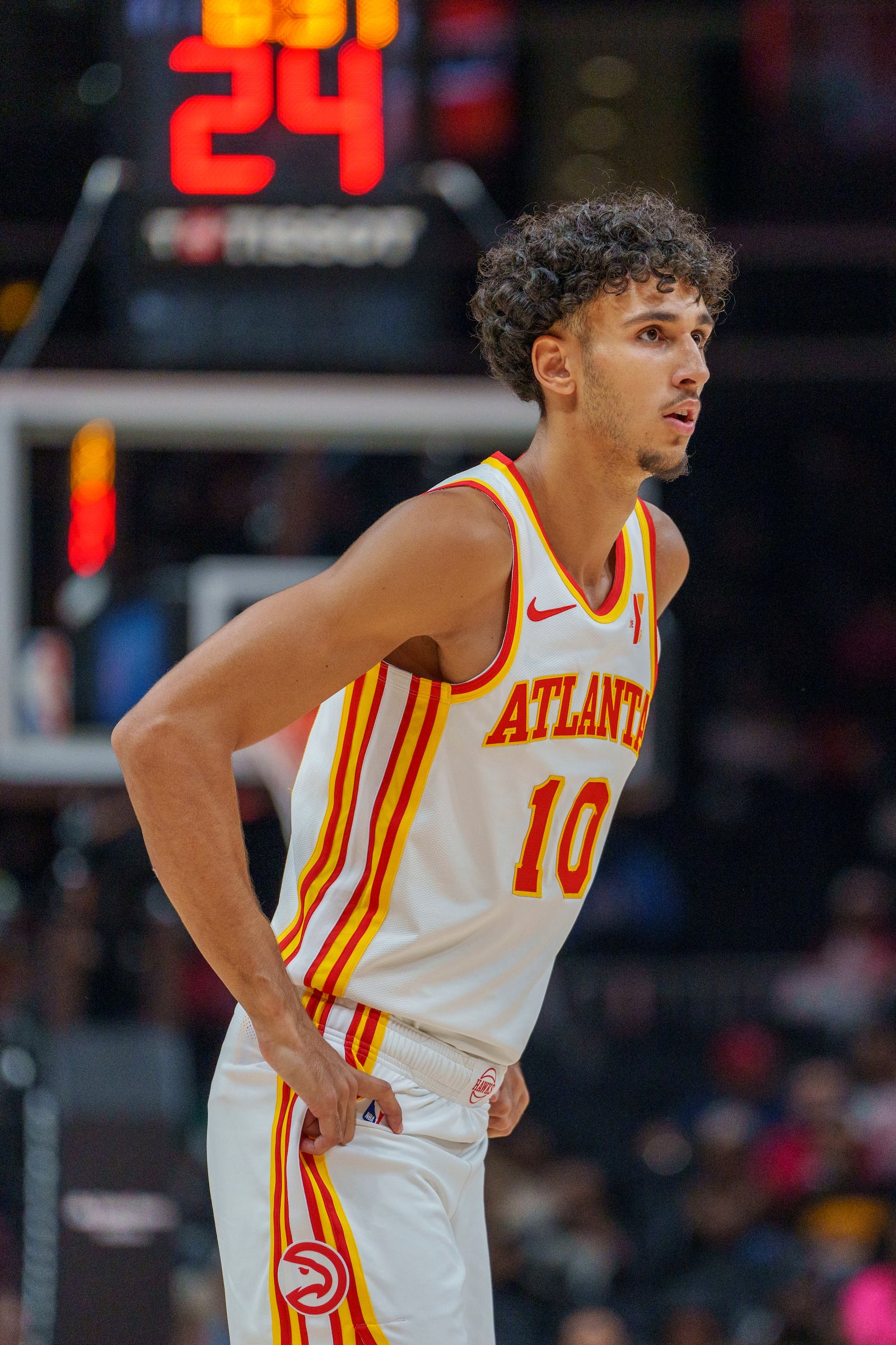 Atlanta Hawks forward Zaccharie Risacher (10) watches the free throws being shot during the first half of a preseason NBA basketball game against the Indiana Pacers, Tuesday, Oct. 8, 2024, in Atlanta. (AP Photo/Jason Allen)