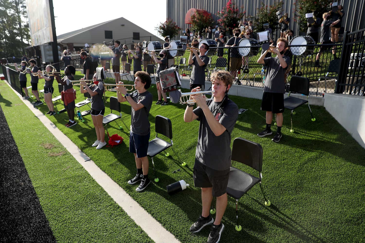 Members of the Cherokee marching band perform social distancing in the first half of Cherokee's football game against Carver-Atlanta at Cherokee high school Wednesday, September 2, 2020 in Canton, Ga.. JASON GETZ FOR THE ATLANTA JOURNAL-CONSTITUTION