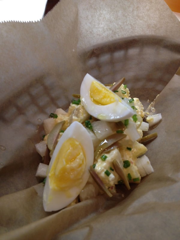 Yuca al aji amarillo with egg and olive is a Latin take on potato salad. (Bob Townsend)