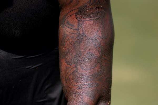 Atlanta Falcons linebacker Mykal Walker has been getting tattoos since 2015 when he got a time glass tattoo on his left bicep honoring his father, who died of cancer in 2012.  (Jason Getz / Jason.Getz@ajc.com)