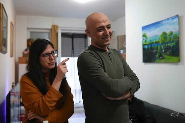 Hasan Zaheda and Nour Essa talk during am interview with the Associated Press in their house in Rome, Sunday, March 2, 2025. (AP Photo/Alessandra Tarantino)