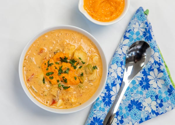 Moqueca is a Brazilian stew of fish and seafood with onion, garlic, bell peppers, tomatoes, cilantro, lime and coconut milk. (Aaliyah Man for The Atlanta Journal-Constitution)