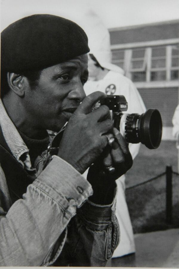 Photo of Jim Alexander shooting at a KKK demonstration in Tupelo MS 1978. Photo credit: by Charles Harris