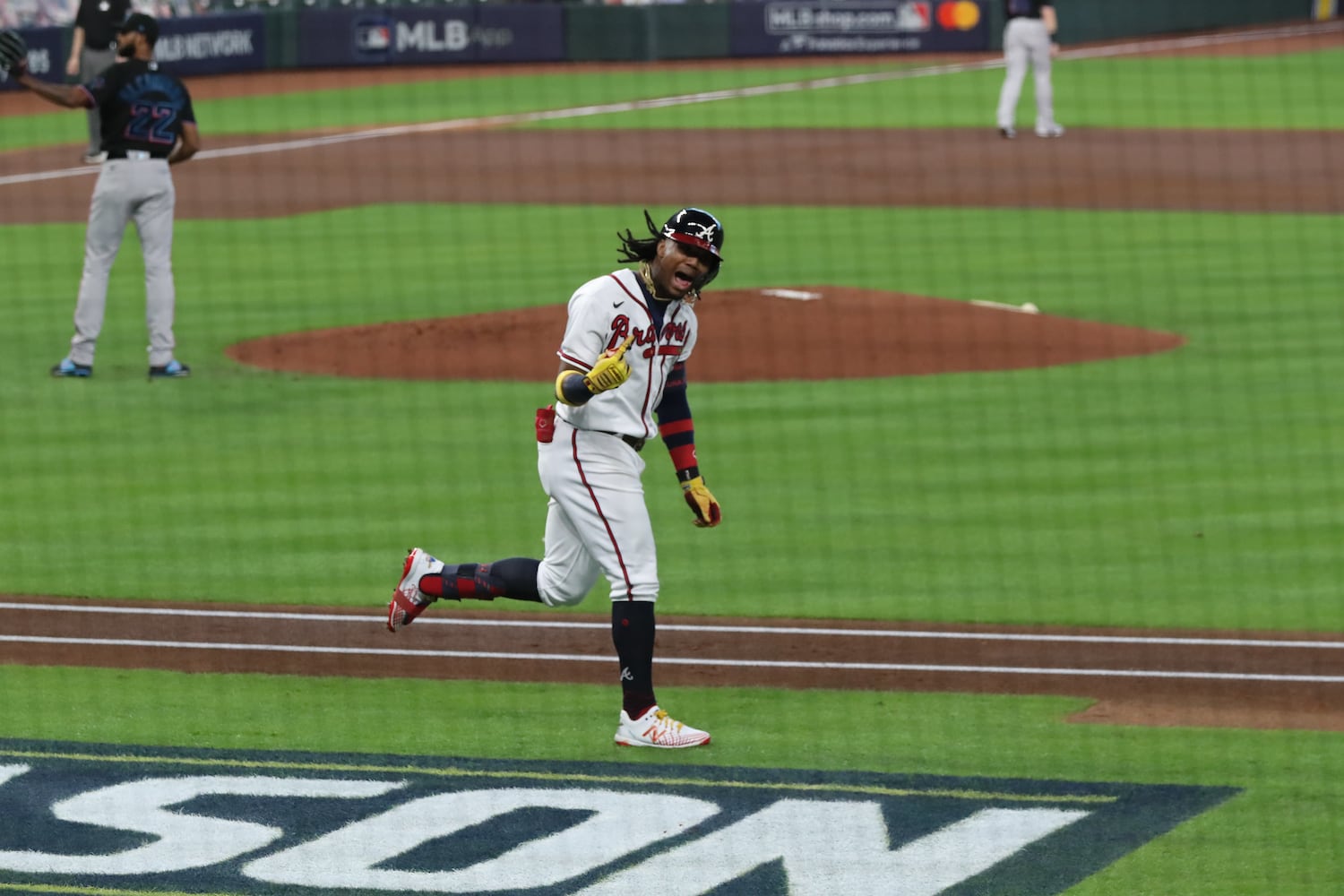 Braves' Ronald Acuna reacts to hitting a solo home run for a 1-0 lead in the first inning of Game 1 of the National League Division Series against the Miami Marlins Tuesday, Oct. 6, 2020, at Minute Maid Park in Houston. The Braves won 9-5. (Curtis Compton / Curtis.Compton@ajc.com)