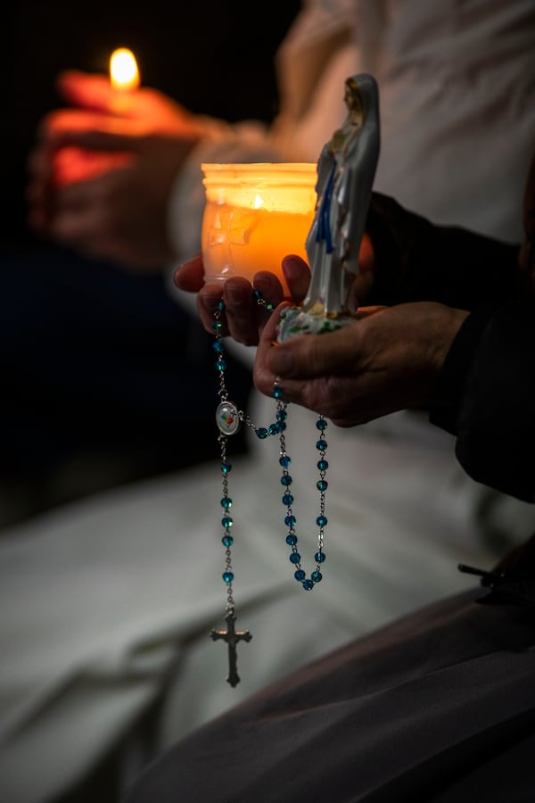 Nuns pray the rosary in St. Peter's Square at The Vatican, Sunday, Mar. 16, 2025, for the health of Pope Francis hospitalized at Agostino Gemelli Polyclinic in Rome where he is being treated for bilateral pneumonia since Feb.14. (AP Photo/Domenico Stinellis)