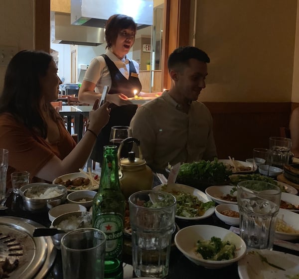 A server brings out a dessert with birthday candles at Han IL Kwan. (Photo courtesy of John Wenzell)