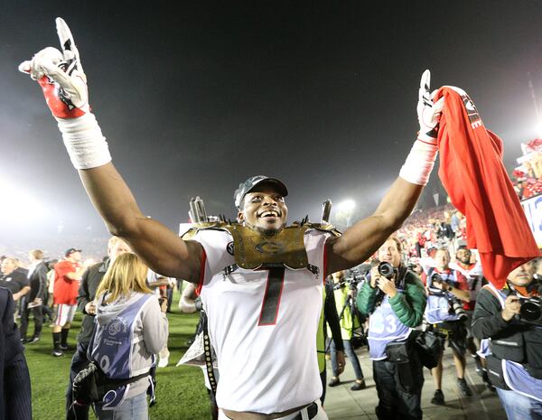 Georgia linebacker Lorenzo Carter celebrates beating Oklahoma 54-48 during double overtime in a College Football Playoff semifinal at the Rose Bowl Game on Jan. 1, 2018, in Pasadena, Calif. (Curtis Compton/ccompton@ajc.com)