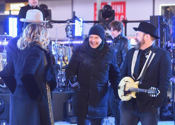  NEW YORK, NY - DECEMBER 31: Ryan Seacrest speaks onstage with Sugarland at the Dick Clark's New Year's Rockin' Eve with Ryan Seacrest 2018 on December 31, 2017 in New York City. (Photo by Nicholas Hunt/Getty Images for dick clark productions)