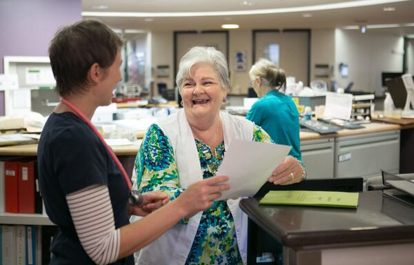 Dunwoody, Ga: Sister Peggy Fannon, who is a nurse educator, talks with RN Genevieve Lyons at the nursing station in the stroke and vascular unit at St. Joseph's Hospital . PHOTO / JASON GETZ